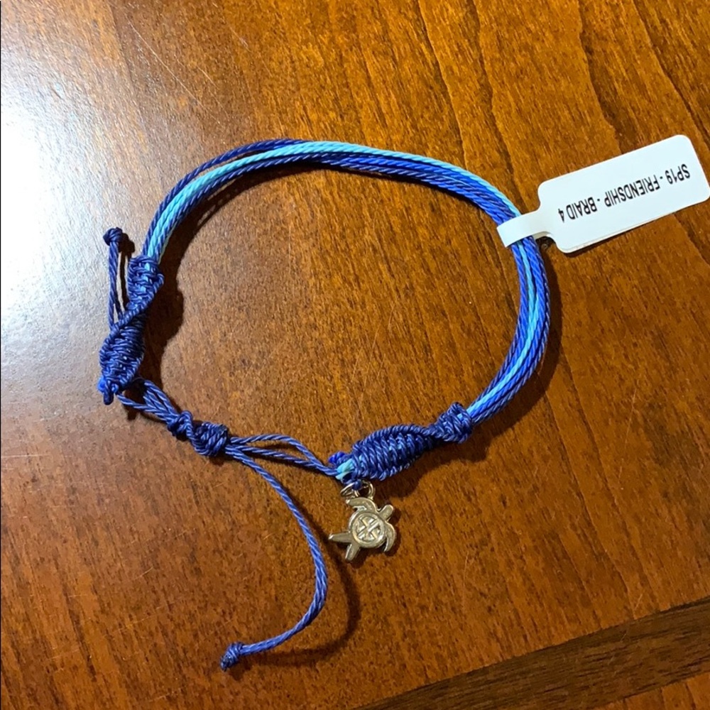 Blue friendship bracelet with sea turtle charm